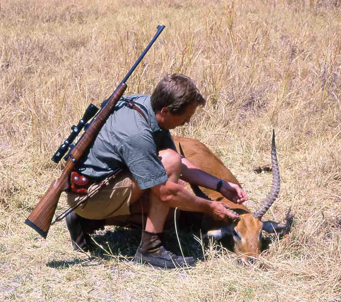 Wieland in Botswana in 1996, with his Dakota Arms 30-06 and a red lechwe taken in the Okavango Delta. He hunted with that rifle for more than a decade, on several continents and it always delivered.